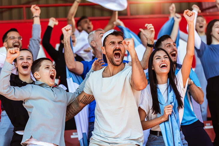 Loud fans and excited spectators at a sporting event.