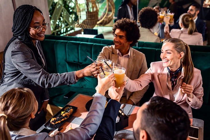 A group of colleagues enjoying drinks after work together.