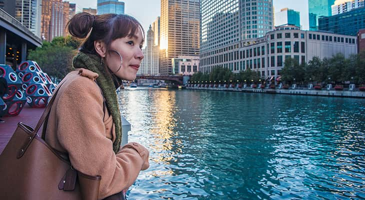 a Chicago tourist looks over the Riverwalk